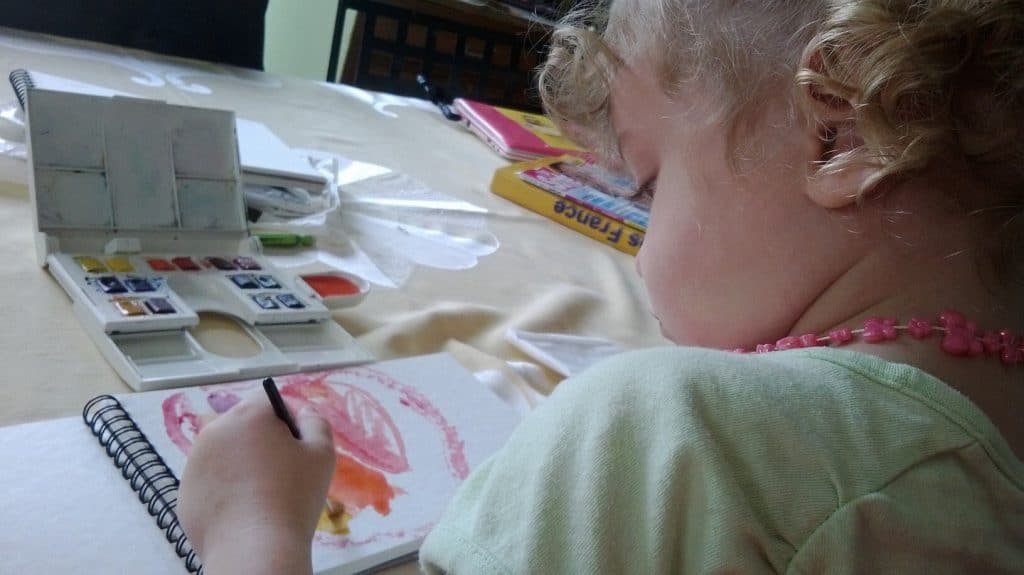 creative kid making an art